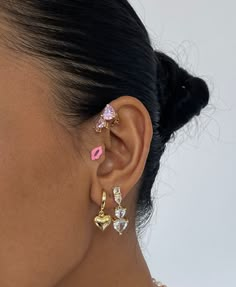 Girl things but make it luxe. Meet our decadent drop earrings that features a substantial, connected-hearts design. Stud backings. Made of 14 Gold-plated over brass and hypoallergenic. Star Shaped Earrings, Earring Stacks Black Women, Pink Earring Stack, Pink Ear Stack, Earring Sets Y2k, Piercing Stacks, Rave Earrings, Mismatched Stud Earrings, Heart Face Earrings