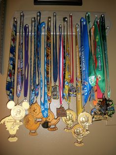 there are many medals hanging on the wall