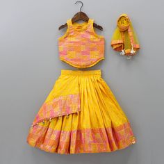 Yellow Multicolour Brocade Printed Top With Pleated Flap Lehenga And Net Dupatta Yellow Sleeveless Set With Dupatta, Traditional Yellow Bandhani Print Choli, Traditional Yellow Sleeveless Anarkali Set, Yellow Sleeveless Anarkali Set, Sleeveless Yellow Anarkali Set, Festive Yellow Brocade Sets, Yellow Art Silk Choli With Bandhani Print, Yellow Brocade Sets With Traditional Drape, Yellow Bollywood Brocade Lehenga