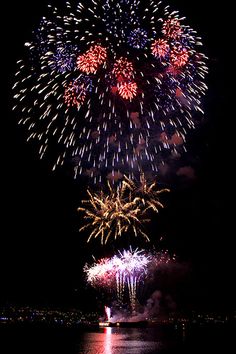 fireworks are lit up in the night sky