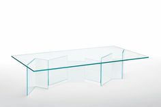 a glass coffee table with three sections on each side