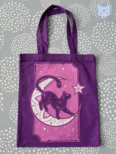 a purple tote bag with a dog on the moon and stars in the sky