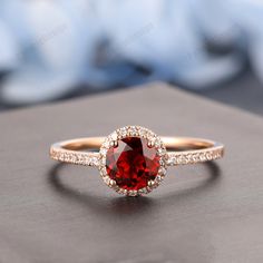 Red Diamond Ring With Halo Setting For Proposal, Red Ruby Halo Ring For Promise, Red Ruby Halo Promise Ring, Red Ruby Ring With Halo In Fine Jewelry Style, 14k Gold Red Halo Rings, Fine Jewelry Red Ruby Ring With Halo, Red Diamond Proposal Ring, Red Solitaire Diamond Ring, Red Solitaire Round Diamond Ring