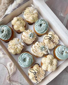 a box filled with cupcakes sitting on top of a table