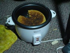 a crock pot with some food inside of it