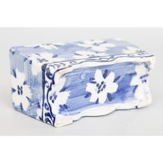 a blue and white box with flowers on it