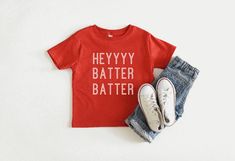 Hey Batter Batter baseball shirt// Baseball Shirt // Kids Baseball shirt // Toddler Baseball shirt // Youth Baseball shirt // Kids Baseball tee Heyyyy Batter Batter youth // toddler // infant shirt These are so fun to customize for your school or team colors! If you have a lettering color in mind other than black or white, send me a message! *Carefully hand made to order on a soft and lightweight Bella + Canvas short sleeve t-shirt. *Also available on a sweatshirt - message me for this option. * Christmas Shirts Kids, Toddler Baseball Shirt, Christmas Pajamas Matching, Funny Baby Shower Gifts, Hey Batter Batter, Retro Baseball, Baseball Design, Kids Baseball, Family Christmas Shirts