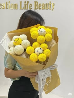 a woman holding a bunch of stuffed animals in her hands with the caption life beauty