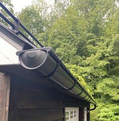 the gutter is attached to the roof of this house