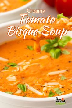 creamy tomato bisque soup in a white bowl