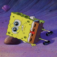 an animated spongebob character standing in the sand