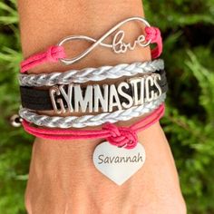 Personalized Gymnastics Bracelet with Engraved Name Charm ⭐GYMNASTICS BRACELET -Infinity Bracelet with Adjustable Clasp & Stainless Steel Name Engraved Charm.   ⭐ADJUSTABLE -Gymnast Bracelets Bracelets Adjust to fit most wrists. New adjustable clasp makes the bracelet fully adjustable to fit a 5 inch to 7 inch wrist. Will fit most kids and teen wrists. ⭐GYMNASTICS GIFT -Perfect Gift For Gymnasts, Gymnastics Teams, Gymnastic Coaches or anyone who loves gymnastics FAST SHIPPING ♥ We ship in 1-2 business days otherwise note, but we do not ship on Saturdays, Sundays, and Holidays. (Possibly same day or Next business day!)  **During holidays, check shop announcement for process time and shipping deadlines.** ♥Item is packaged with care in a padded envelope in my branded packaging. ♥You will rec Gymnastics Jewelry, Gymnastics Gifts, Gymnastics Team, Gymnastics Girls, Birthstone Charms, Gymnast, Initial Charm, Infinity Bracelet, Fashion Watches