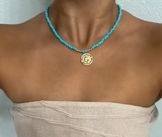 𝐄𝐗𝐐𝐔𝐈𝐒𝐈𝐓𝐄 𝐓𝐔𝐑𝐐𝐔𝐎𝐈𝐒𝐄: Elevate your style with a turquoise necklace featuring carefully selected turquoise beads and a stunning coin pendant 𝟏𝟒𝐊 𝐆𝐎𝐋𝐃 𝐅𝐈𝐋𝐋𝐄𝐃: Indulge in the opulence of a celestial necklace adorned with high-quality 14K gold filled accents for a timeless and elegant touch 𝐆𝐋𝐎𝐑𝐈𝐎𝐔𝐒 𝐅𝐔𝐒𝐈𝐎𝐍: Unleash the allure of gemstones seamlessly combined with gold balls, creating a magnificent and radiant accessory that captivates attention 𝐓𝐈𝐌𝐄𝐋? Turquoise Necklaces, Contemporary Jewelry Design, Celestial Necklace, Turquoise Bead Necklaces, Coin Jewelry, Necklaces Jewelry, Coin Necklace, Coin Pendant, Contemporary Jewelry