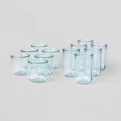 a set of twelve glass jars with lids