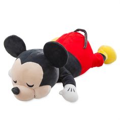 a mickey mouse stuffed animal laying on its side