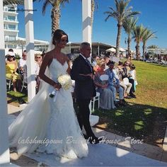 the bride and groom are walking down the aisle