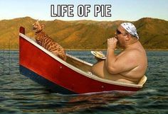 a man sitting in a boat with a cat on his lap and the caption life of pie