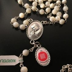 Special Canonization rosary - released for the special eventBLESSED on 04-27 During the mass for Canonization!!!What a wonderful rosary. It's finely hand made. Both feminine and gracefully designed, this lovely rosary has Mother of Pearl gemstone beads.Beads size is 6 mm. It has been blessed by Pope Francis during public audience. I've brought it personally as a free gift to the purchaser.On the rosary there is a special pendant for our newly canonized Saint: a medal with a relic of his tunic (e White Spiritual Rosary With Miraculous Medal, Spiritual White Rosary With Miraculous Medal, Vintage White Rosary As A Gift, White Necklace With Miraculous Medal And Round Beads, San Juan Pablo Ii, St John Paul Ii, Faith Necklace, Pearl Rosary, The Special One