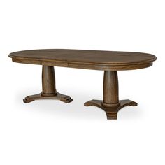 an oval wooden table with two pedestals on each side and one leg at the end