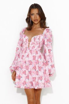 Length from bust to hem of size S: 63cm. Chest: 36cm, Waist: 30cm, size S. Mini dress. Semi-lined. Model is a standard XS and is wearing size XS. True to size. Non-stretch. Elastic details. V-neck. Puff sleeves. Flowy skirt. Zipper. Cold hand wash only. Polyester/Rayon. A special look for a special gal like you. The Expressing Fun Long Sleeve Mini Dress features a sultry V-neck and long puff sleeves. Style with heels for a party or sandals for brunch. Pink Flowy Dress Long, Flowy Dress Long Sleeve, Floral Pink Dress, Flowy Dress Long, Mini Dress Pink, Flowy Mini Dress, Skirt Zipper, Sleeves Style, Long Sleeve Lace Dress