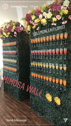 a display with flowers and drinks on it