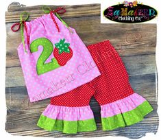 Zamakerr Clothing Co. presents this adorable Custom Boutique Girl STRAWBERRY OUTFIT Available Sizes - 3 6 9 12 18 24 month Size 2T 2 3T 3 4T 4 5T 5 6 7 8 PLEASE INDICATE THE LETTER OR NUMBER NEEDED FOR THE BODICE IN THE NOTES TO SELLERS BOX** OUR GUARANTEE TO YOU QUALITY TOP NOTCH SEWING AND PROMPT COMMUNICATION (usually within 1 hour M-F)(usually within 2-3 hours WEEKENDS). THIS IS NOT OUR HOBBY - IT IS OUR BUSINESS! Ordering up a size is not suggested. Outfits are very true to size with a litt Cute Pink Holiday Sets, Playful Pink Sets For Holiday, Playful Pink Holiday Sets, Cute Ruffled Sets For Birthday, Cute Ruffled Sets For First Birthday, Cute Red Sets For Birthday, Fun Pink Sets For First Birthday, Pink Ruffled Birthday Set, Cute Multicolor Sets For First Birthday