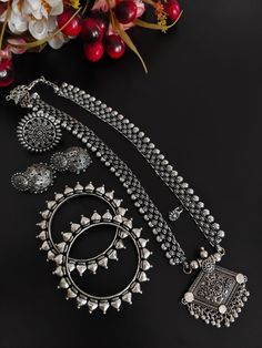 This minimalistic long oxidized necklace set is perfect for an Indian bride. Beautifully designed with German oxidized silver, this wedding set has a big intricate long Haram oxidized necklace, a pair of jhumki earrings, a ring, a pair of bangles, and a nose pin. This bridal oxidized set is available in six different patterns and sizes. Each of these pieces will work wonderfully on its own and even more elegant when worn together. You can also style them with your Navratri outfit or any ethnic o Long Oxidised Necklace, Fusion Style Oxidized Wedding Jewelry, Fusion Style Oxidized Finish Wedding Jewelry, Antique Silver Oxidized Wedding Jewelry, Wedding Fusion Jewelry With Oxidized Finish, Festive Oxidized Finish Bridal Necklace, Festive Oxidized Bridal Necklace, Chandbali Oxidized Wedding Jewelry Sets, Wedding Chandbali Jewelry Sets With Oxidized Finish