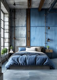 a bedroom with blue walls and concrete flooring, along with a large bed in the middle