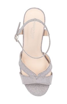 A glittery upper adds soirée-ready appeal to an elegant sandal set on a cushioned footbed and wrapped block heel. 2 3/4" heel Adjustable ankle strap with buckle closure Memory foam cushioning Water resistant Synthetic upper, lining and sole Imported Sparkling Block Heel Synthetic Heels, Synthetic Block Heels With Sparkling Details, Sparkling Synthetic Block Heel Shoes, Glamorous Sparkling Ankle Strap Sandals, Sparkling Synthetic Block Heel Heels, High Heel Shimmer Sandals In Synthetic Material, Glamorous Ankle Strap Sandals With Glitter, Glamorous Glitter Ankle Strap Sandals, Glamorous Glitter Sandals With Ankle Strap