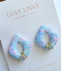 Add a little pop of color to your every day attire with these pink and blue marbled earrings!  Each pair is handmade, so color and pattern could vary slightly. Trendy Pastel Earrings For Gift, Cute Blue Polymer Clay Jewelry, Artsy Blue Polymer Clay Earrings, Trendy Handmade Pastel Earrings, Cute Blue Resin Earrings, Blue Artsy Resin Earrings, Artsy Blue Resin Earrings, Cute Blue Polymer Clay Earrings, Blue Clay Earrings