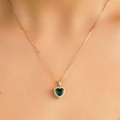 Capture her heart on her May birthday with this detailed fashion pendant. Crafted in sterling silver, this romantic design features a 7.5mm heart-shaped green emerald wrapped in a halo frame of shimmering white sapphires. Buffed to a brilliant luster, this heart suspends close to hers along a cable chain. Style ID: N220046SYLEMetal: SilverMetal Color: YellowRhodium Finish: YesNecklace Length: 16"/18"/20"Stone(s): Lab-Grown EmeraldTotal Weight (CT. T.W.): 1.68 Carat Stone Dimension: 7.5mmStone Sh Luxury Heart-shaped Natural Stones Necklace, Luxury Heart-shaped Natural Stone Necklaces, Luxury Green Heart Pendant Jewelry, Luxury Green Heart-shaped Necklaces, Cheap Green Heart Pendant Jewelry, Luxury Green Necklace With Heart Charm, Luxury Green Heart-shaped Necklace, Green Jewellery, Sapphire Heart Necklace