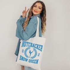 This 100% cotton bag comes in one size - 15" x 16"- perfect for everyday wear. While the canvas material will show off your designs in great colors, it's durable and will last for years. The bag features 20" handles (made from the same canvas), making it easy to carry even with a week's worth of shopping. .: 100% cotton canvas .: Heavy fabric (12 oz/yd² (406.9 g/m .: Sewn-in label .: Available in natural and black colors Nutcracker Snow Queen Gifts, Dancer Gift, Nutcracker Ballet, Pointe Shoes, Snow Queen, Ballet Dancers, Nutcracker, Cotton Bag, Canvas Material