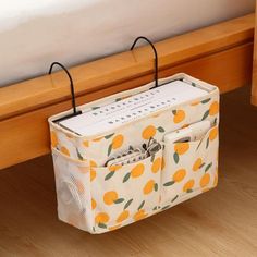 an orange print storage box on the floor