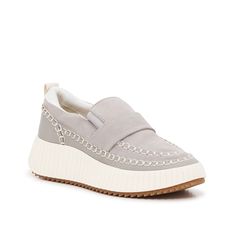 Dolce Vita-Dayo Slip-On Touch up a look with the sporty Dayo slip-on from Dolce Vita. The sneaker-inspired design lends a casual hand, while the molded wedge heel takes you higher. Spring Slip-on Sneakers With Studded Outsoles, Casual Spring Slip-on Sneakers With Studded Outsoles, Casual Gray Platform Sneakers, Gray Slip-ons With Textured Sole For Spring, Casual Slip-on Synthetic Wedge Sneakers, Casual Synthetic Slip-on Wedge Sneakers, Gray Synthetic Slip-ons With Textured Sole, Casual Slip-on Wedge Sneakers For Spring, Slip-on Wedge Sneakers With Rubber Sole