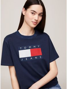 Tommy Hilfiger women's T-shirt. This pure cotton T-shirt is proudly printed with the iconic Tommy flag badge, making it a streetwear wardrobe hero. Part of our Tommy Jeans collection.  Material: 100% Transitional Cotton ,  In-conversion. Streetwear Wardrobe, Badge Making, Jeans Collection, Tommy Hilfiger Women, Dark Night, Tommy Jeans, Cotton T Shirt, Pure Cotton, Tshirt Print