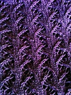 purple knitted fabric with small leaves on it