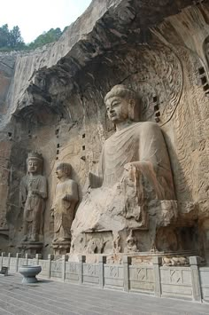 an image of some statues on the side of a building that looks like it is carved from stone