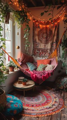 a hammock hanging from the ceiling in a room with plants and rugs