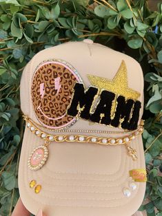 Hat chains are removable with clasps on each end. They can be bought separate or with the hat. Please allow up to 2 weeks for this hat to ship as this is a pre-order item.  $10-$12 chain options do not include hats.  $40-$50 bling hat options do include trucker hat and bling as pictured.  For clarification when purchasing: If you purchase one of the hat chain options, this is individual hat chains and DOES NOT include the trucker hat. If you purchase the bling hat option, this option includes th Trendy Gold Cap, Trendy Gold Snapback Hat, Trendy Adjustable Gold Hats, Trendy Gold Hat As Fashion Accessory, Trendy Gold Hats As Fashion Accessory, Gold Cap Hat As Gift, Adjustable Gold Hats For Gifts, Adjustable Gold Hats As Gift, Trendy Adjustable Gold Trucker Hat