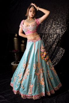 Sky blue flared lehenga with gullista embroidery using resham thread, cutdana, beads, sequins, pearls highlights. Paired with a pink half sleeves sweetheart neck choli style blouse with floral embroidery using mirror jaal, resham thread, beads highlights, dangling glass beads and a contrasting yellow cutwork border motif stripe embroidered dupatta. - Aza Fashions Blue Meenakari Sharara For Navratri, Blue Meenakari Sets For Wedding, Blue Bollywood Sharara With Meenakari, Festive Blue Meenakari Sets, Blue Anarkali Choli With Meenakari, Blue Meenakari Lehenga For Navratri, Blue Bollywood Choli With Meenakari, Festive Blue Meenakari Sharara, Designer Meenakari Blue Lehenga