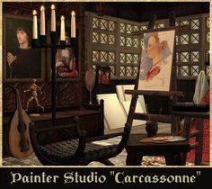 a painting studio with candles and pictures on the wall