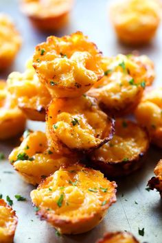 some food that is on top of a table with little pieces of bread in the middle