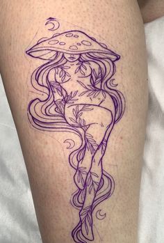 a woman with long hair and mushrooms on her thigh