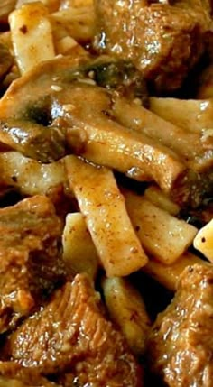 some meat and pasta on a plate with broccoli