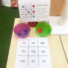 a table with two bowls and a sign on it that says 3 in a row