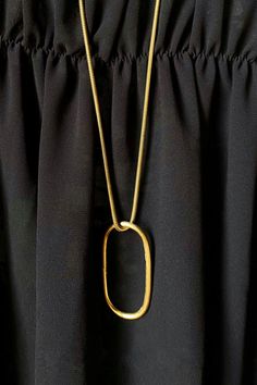 The pendant’s oblong silhouette earns it the name 'Adas' or ‘lentil' in Arabic. Because of Adas' long 29.5" chain, she offers a relaxed touch to any look. A simplistic design with a wide range of wearability. Sister style in the Adas Collection. Elegant Oblong Chain Necklace, Modern Oval Pendant Necklace With Chain, Minimalist Metal Oval Link Necklace, Metal Chain Necklace With Oval Pendant, Gold Necklace With Oval Pendant Box Chain, Minimalist Jewelry With Adjustable Oblong Chain, Minimalist Oval Necklaces With Gold Chain, Modern Necklaces With Rectangular Pendant And Adjustable Chain, Gold Oblong Necklace With Cable Chain