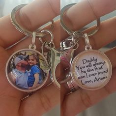 two key chains that have pictures on them, one with a man and the other with a woman