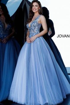 Jovani 3110 is a stunning tulle ball gown 2020 Prom Dress. Embellished 3D Floral Appliques on Sheer Illusion Bodice. Deep V Neckline & Back. This gown would be a Perfect Sexy Wedding Dress In Ivory! Available Sizes: 00, 0, 2, 4, 6, 8, 10, 12, 14, 16, 18, 20, 22, 24 Available Colors: blue, ivory, red Closure: Invisible Back Zipper with Hook and Eye Closure. Details: Blue tulle ballgown, full floor length skirt, sleeveless sheer bodice covered with floral appliques, low V neck, V back. Fabric: 100 Floral Ball Gown, Jovani Gown, Tulle Ballgown, Whimsical Dress, Jovani Prom, Unique Prom Dresses, Ball Gown Skirt, Blue Tulle, Sequin Prom Dresses