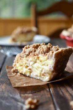 a piece of pie sitting on top of a wooden table