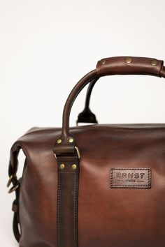 Made for the ones who appreciate authenticity and quality. 100% leather, ERNST weekenders come in two carry-on friendly sizes - ERNST Large is W50 cm X D25 cm X H30-42 cm and ERNST Medium W45 X D25 X H25-35 cm. Hand made in Europe, shipped worldwide. Classic Brown Travel Bag With Leather Trim, Brown Leather-lined Weekender Bag For Business Trips, Classic Business Duffle Bag With Waxed Finish, Classic Waxed Finish Duffle Bag For Business, Classic Leather Weekender Bag For Trips, Classic Everyday Travel Bag With Waxed Finish, Classic Brown Duffle Bag With Waxed Finish, Classic Brown Travel Bag, Classic Leather Travel Bag For Trips